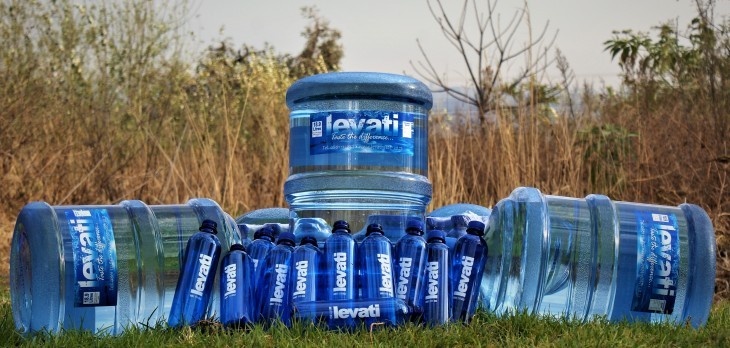 Water pouring into glasses